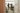 two women in a doorway looking at art